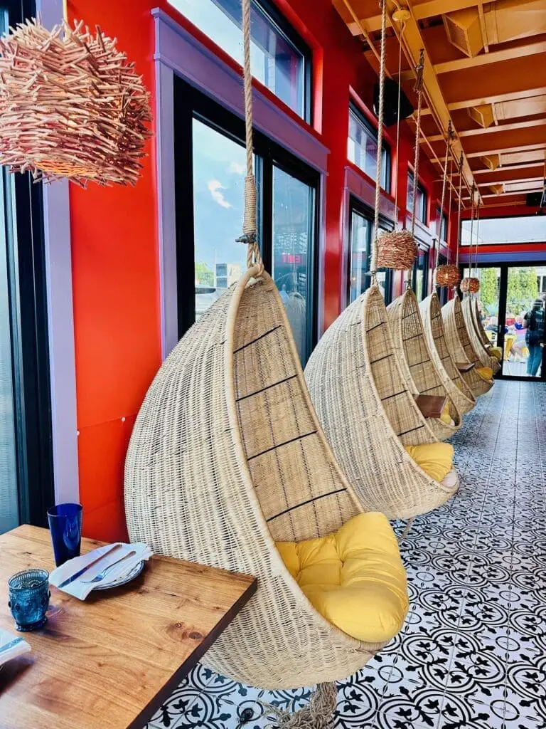 Tulum row of hanging chairs inside guacamole modern mexican louisville