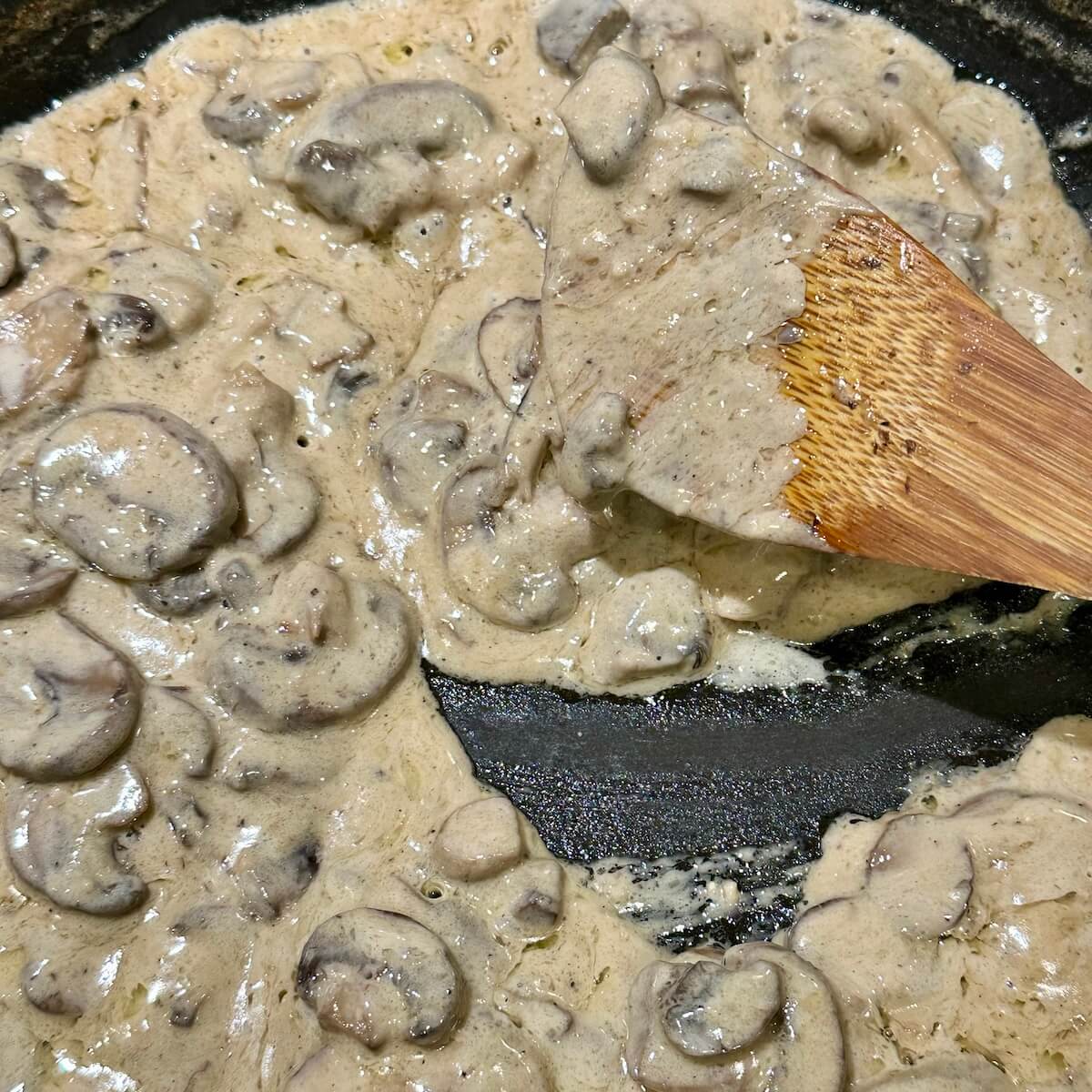Browned mushroom sauce in pan
