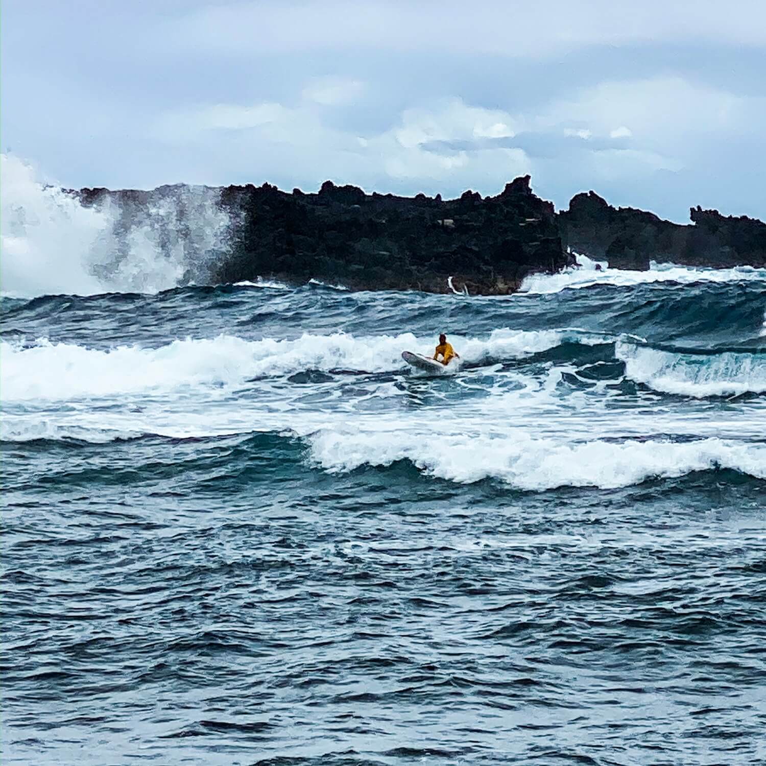 Surfer black sand beach punalu'u big island hawaii