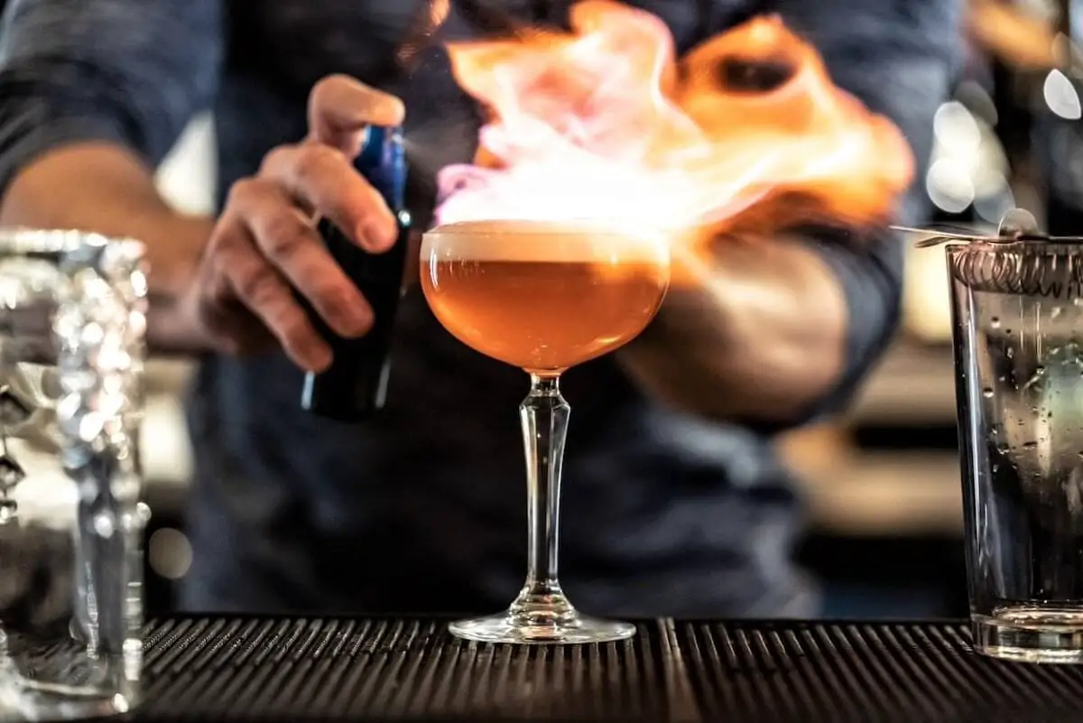 Tongue and groove drinkery flaming cocktail