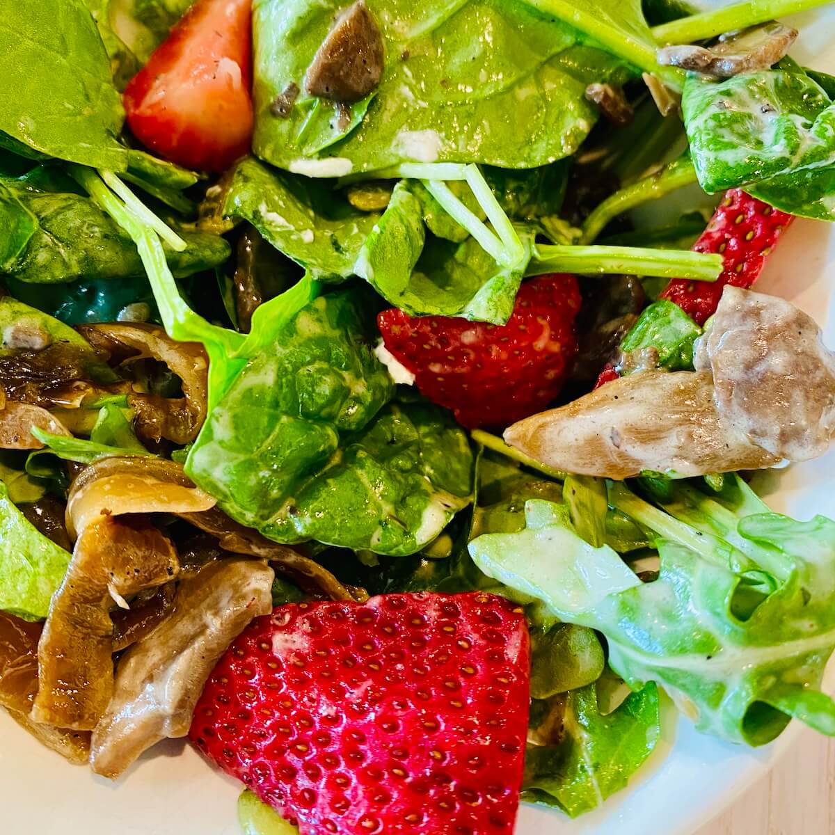 Warm mushroom spinach salad with strawberries