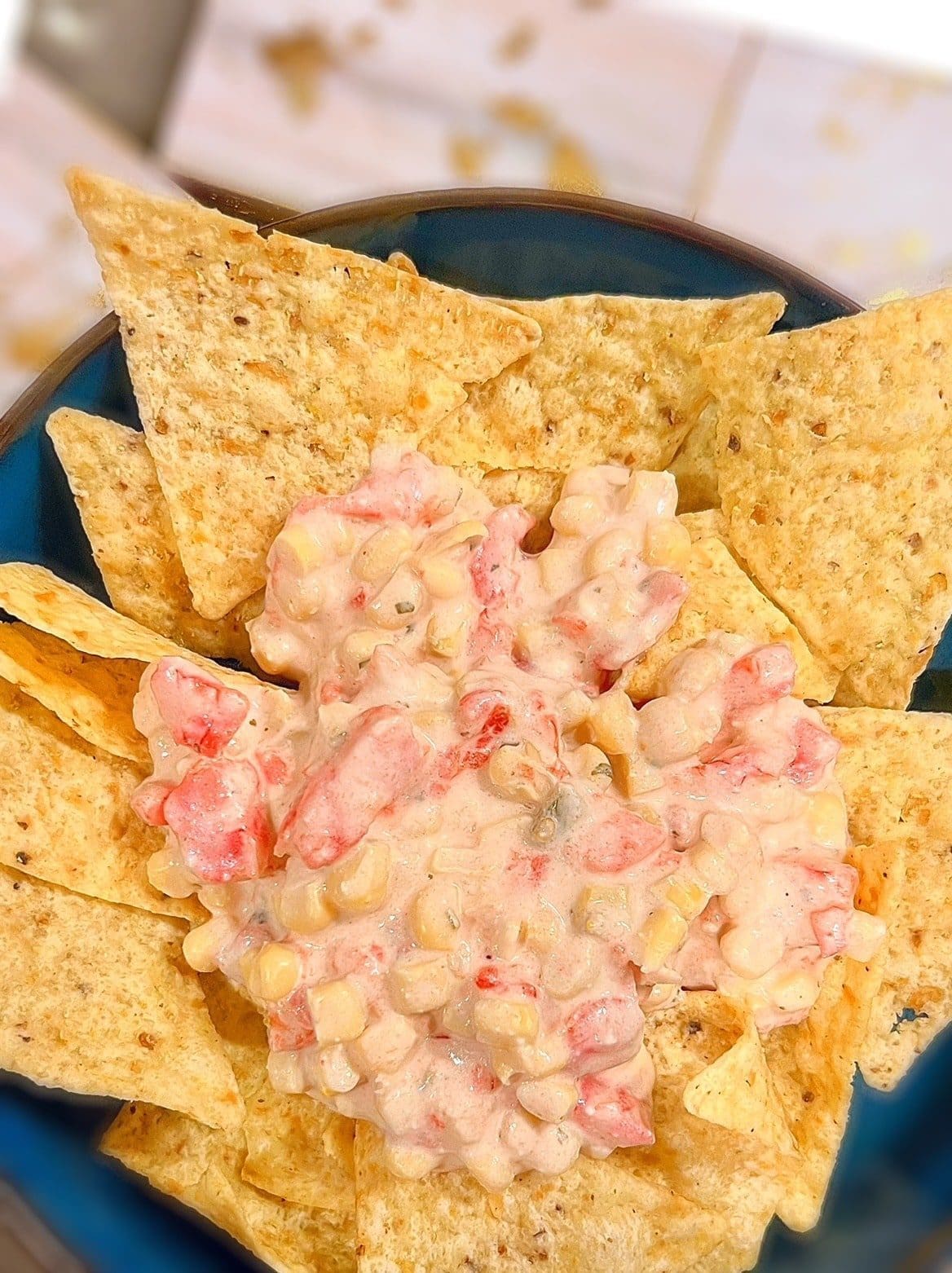 Corn dip with rotel and cream cheese on tortilla chips
