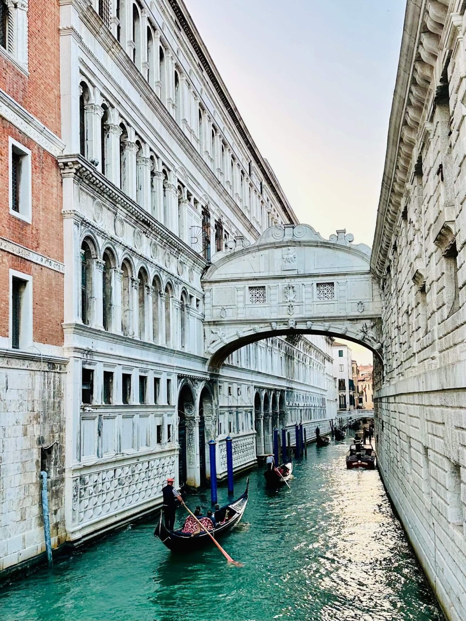 Gondolas under bridge of sighs canal venice