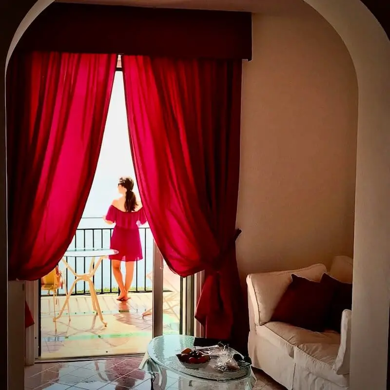Pink curtains balcony amalfi coast