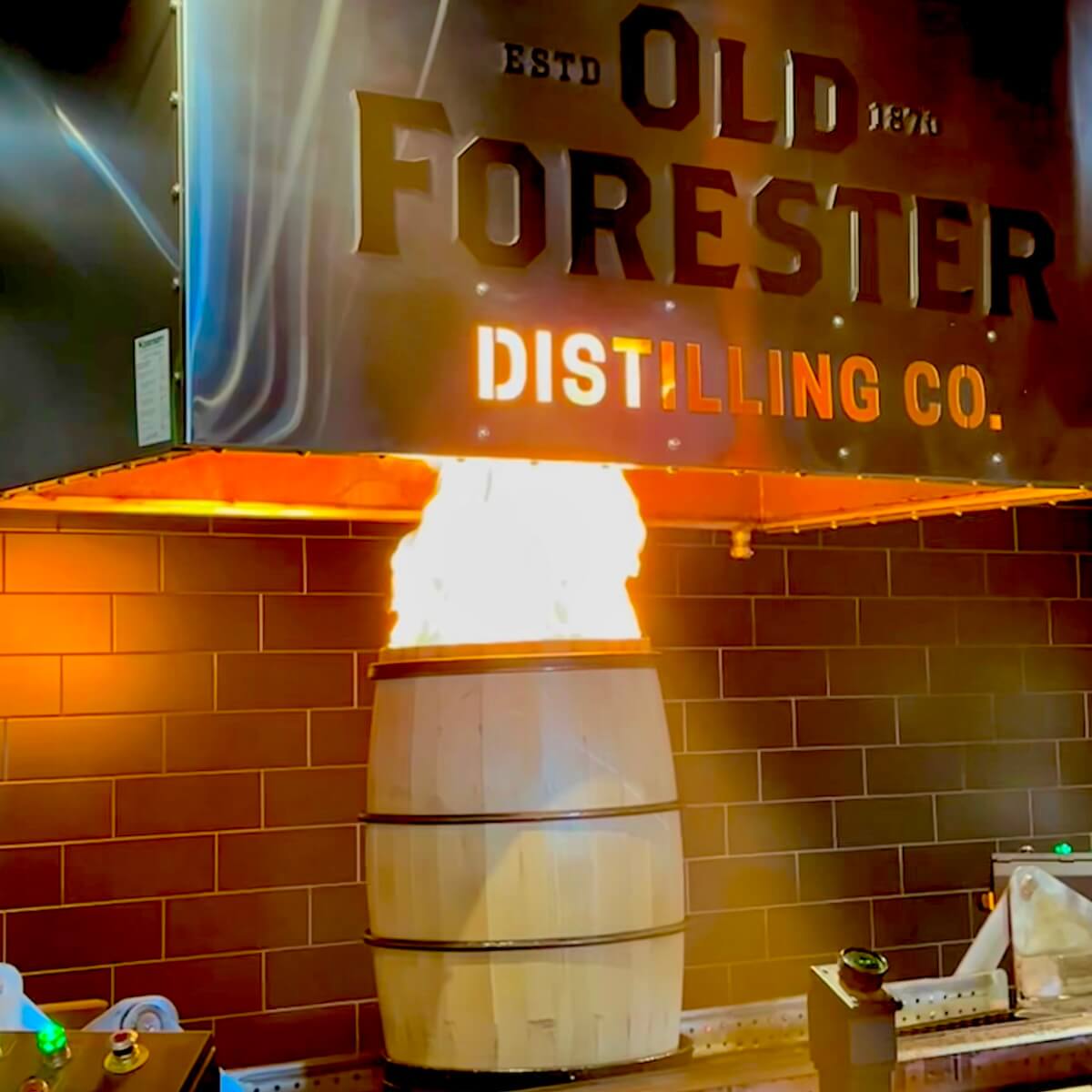 Charring a bourbon barrel at old forester distillery